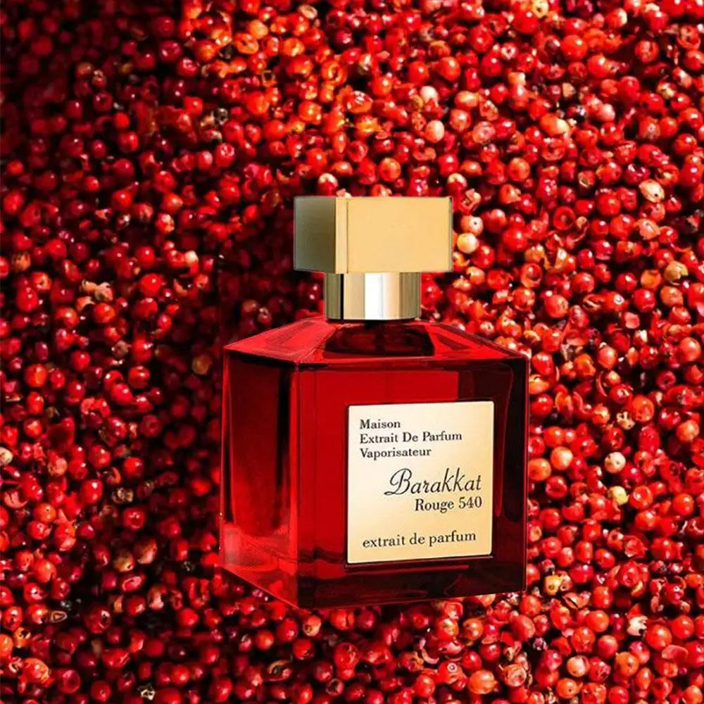 Red Barakkat perfume bottle on a red berry background